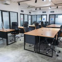Interior of bankrupt empty modern office coworking space temporarily closed and policy for employees to work from home during pandemic of Covid-19, Coronavirus